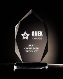 A sleek, crystal-clear GNEX 2025 Vacation Industry Award for Best Consumer Product, displayed against a dark background.
